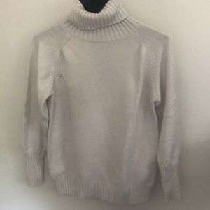 White turtleneck sweater, great for layering! Good for skiing innerwear as well.